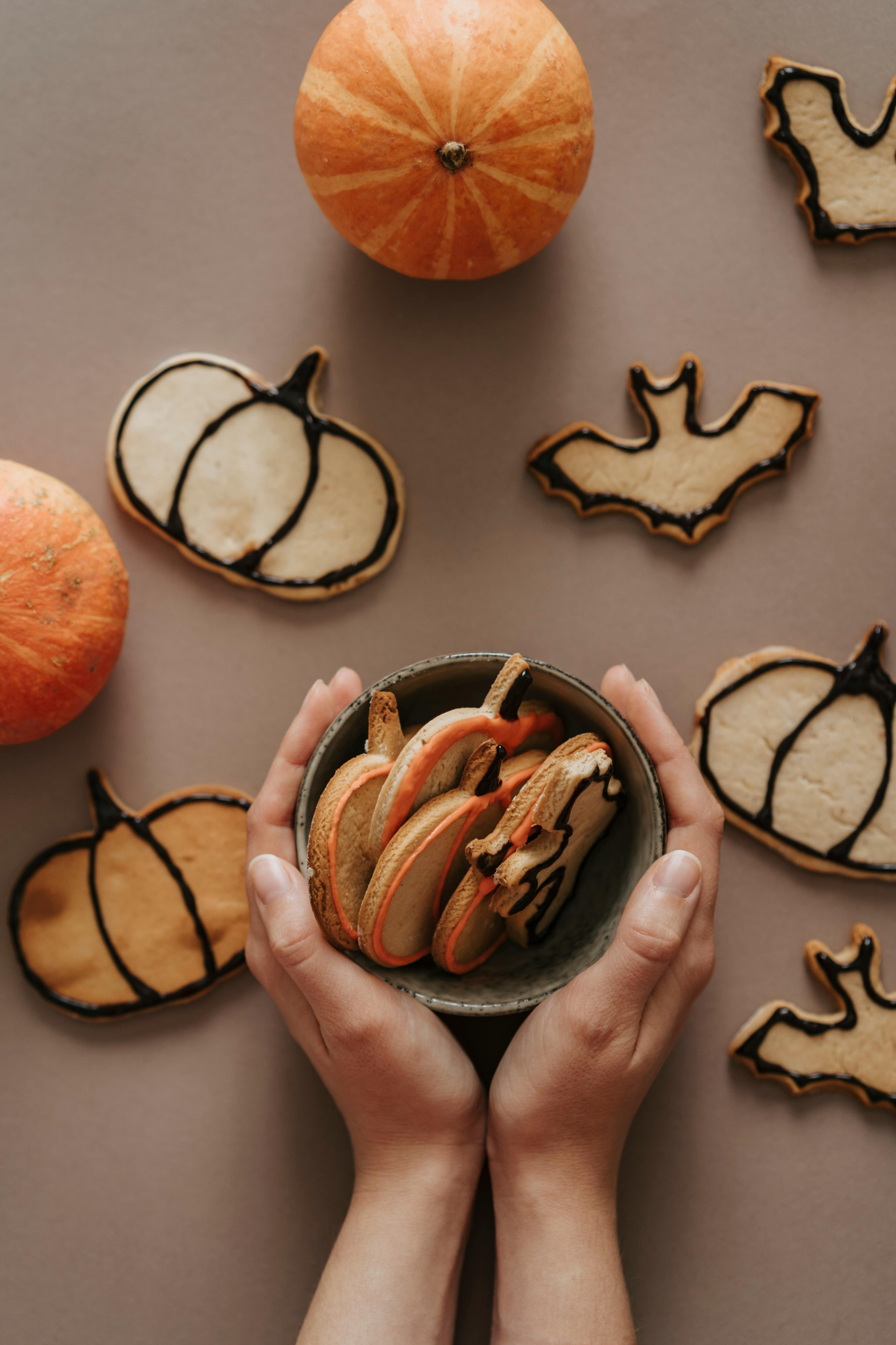 Halloween cookies and sweets in a bowl during kids club party